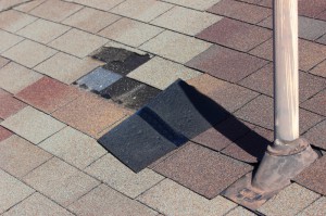 A roof with dislodged shingles